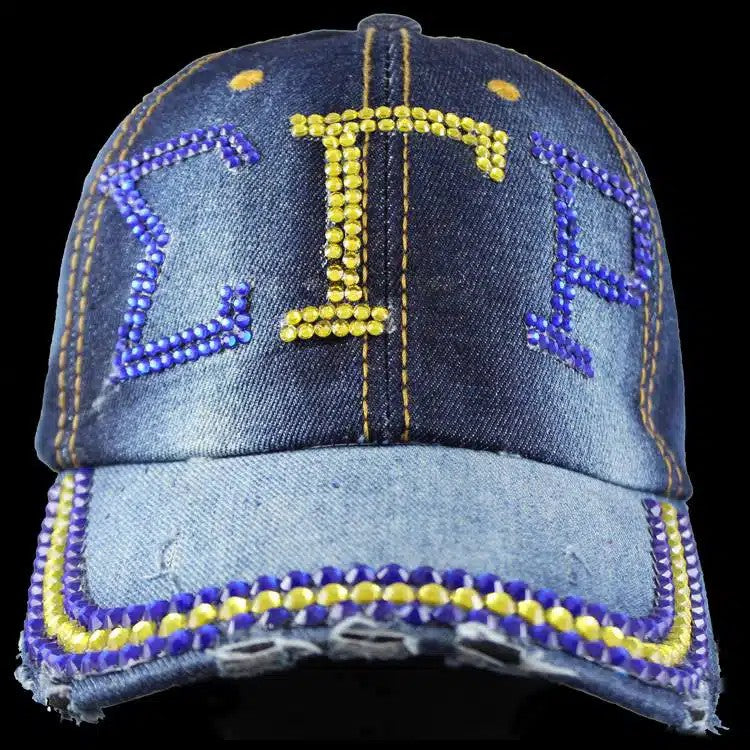 Denim cap with rhinestone embellishments on a black background