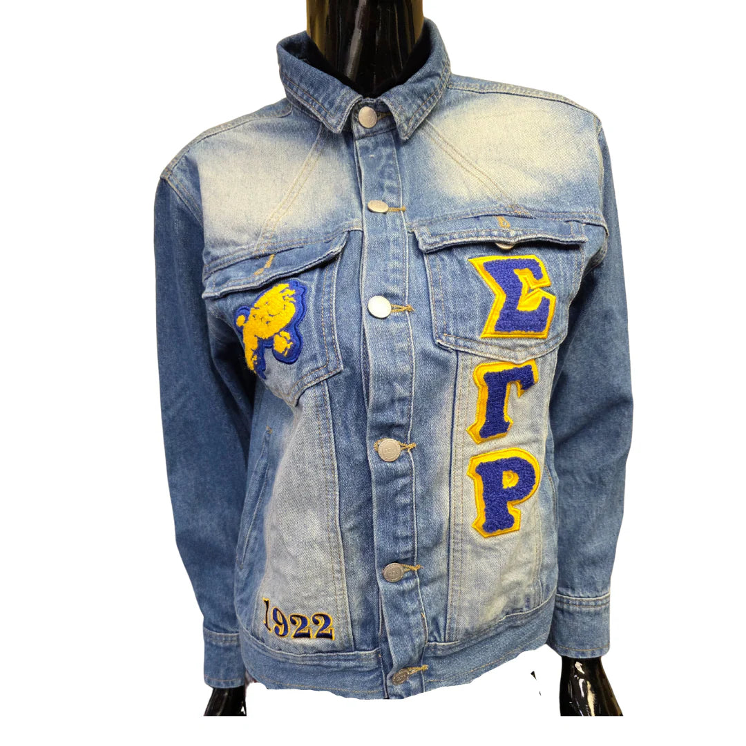 Denim jacket with embroidered letters and numbers on a white background
