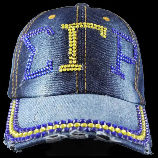 Denim cap with rhinestone embellishments on a black background