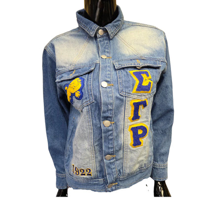 Denim jacket with embroidered letters and numbers on a white background