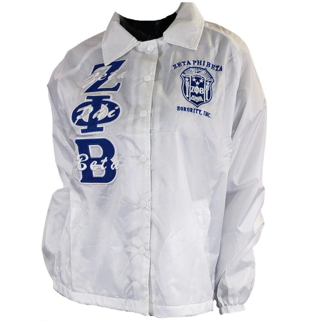 White jacket with blue and black lettering and symbols on a white background