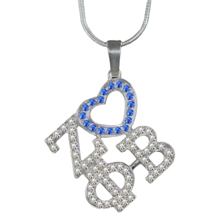 Necklace with 'zøb' pendant featuring blue and clear stones on a black background
