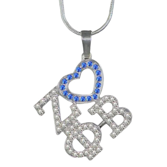 Necklace with 'zøb' pendant featuring blue and clear stones on a black background